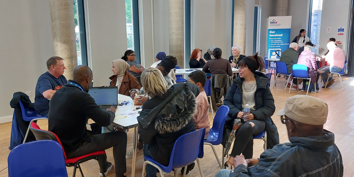 ISHA staff and residents chatting and discussing issues at our Hackney Neighbourhood Night in May 2026.