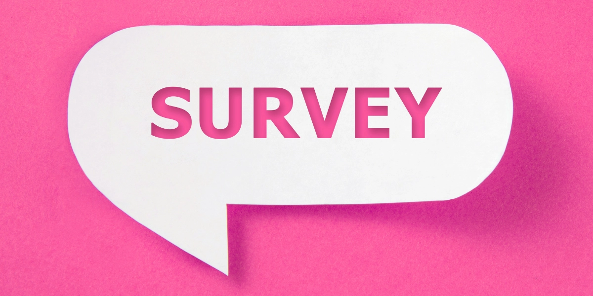 A white speech bubble on a pink background with the word Survey inside