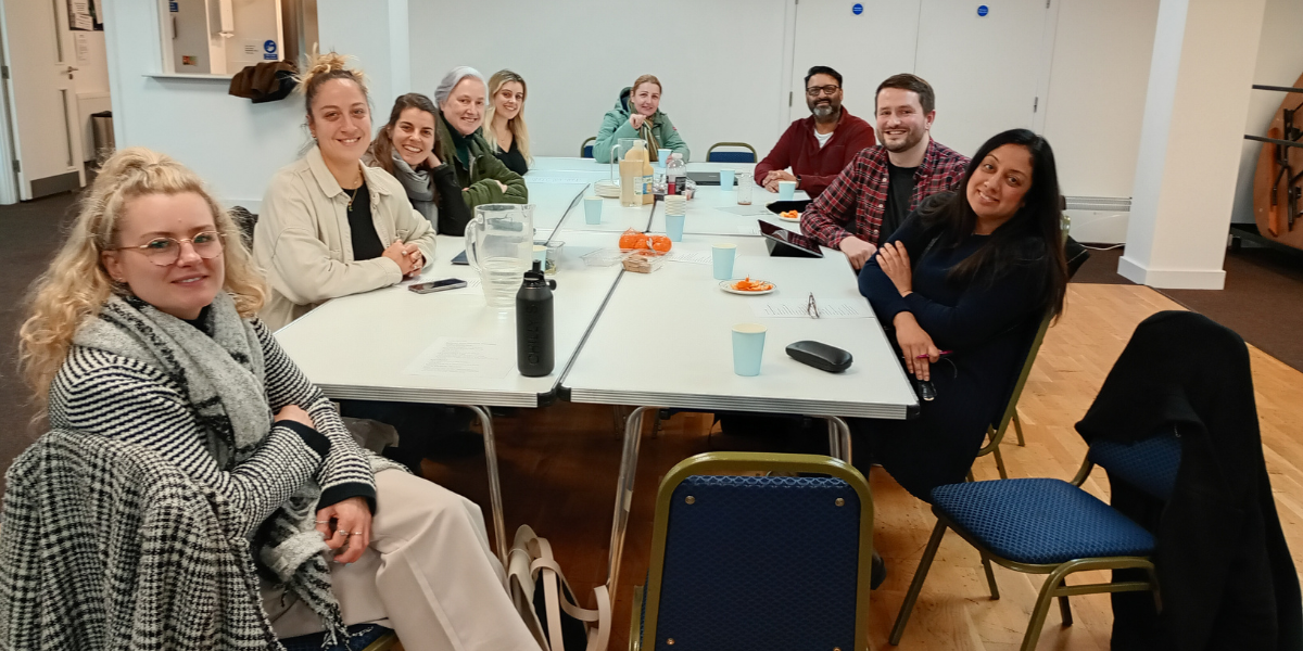 Smiling people having a meeting.