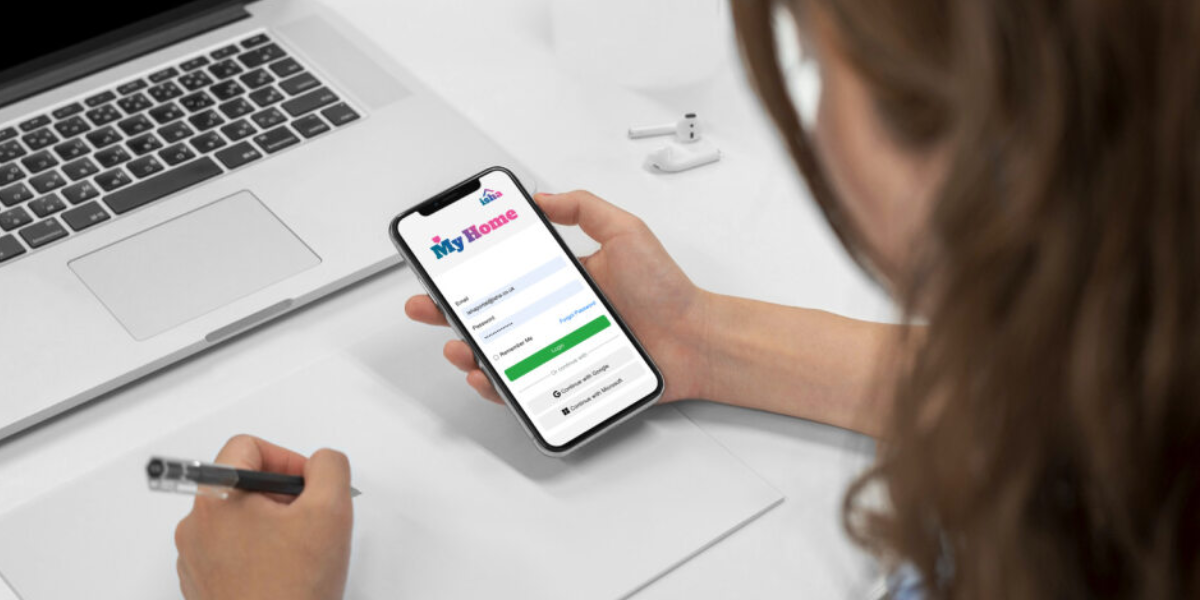 A woman accesses 'My Home' on her smart phone